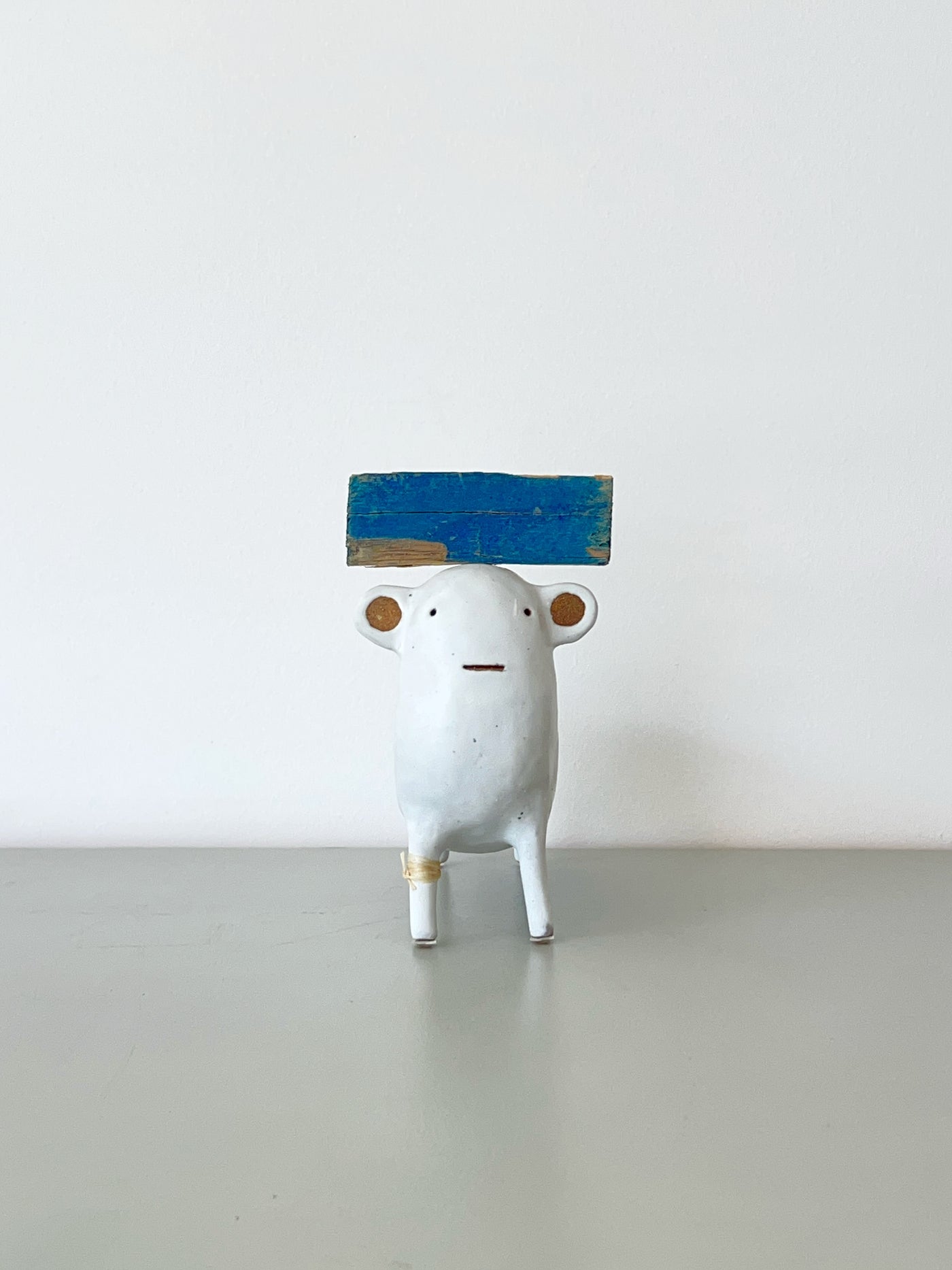 White with Blue Hat and Rawhide