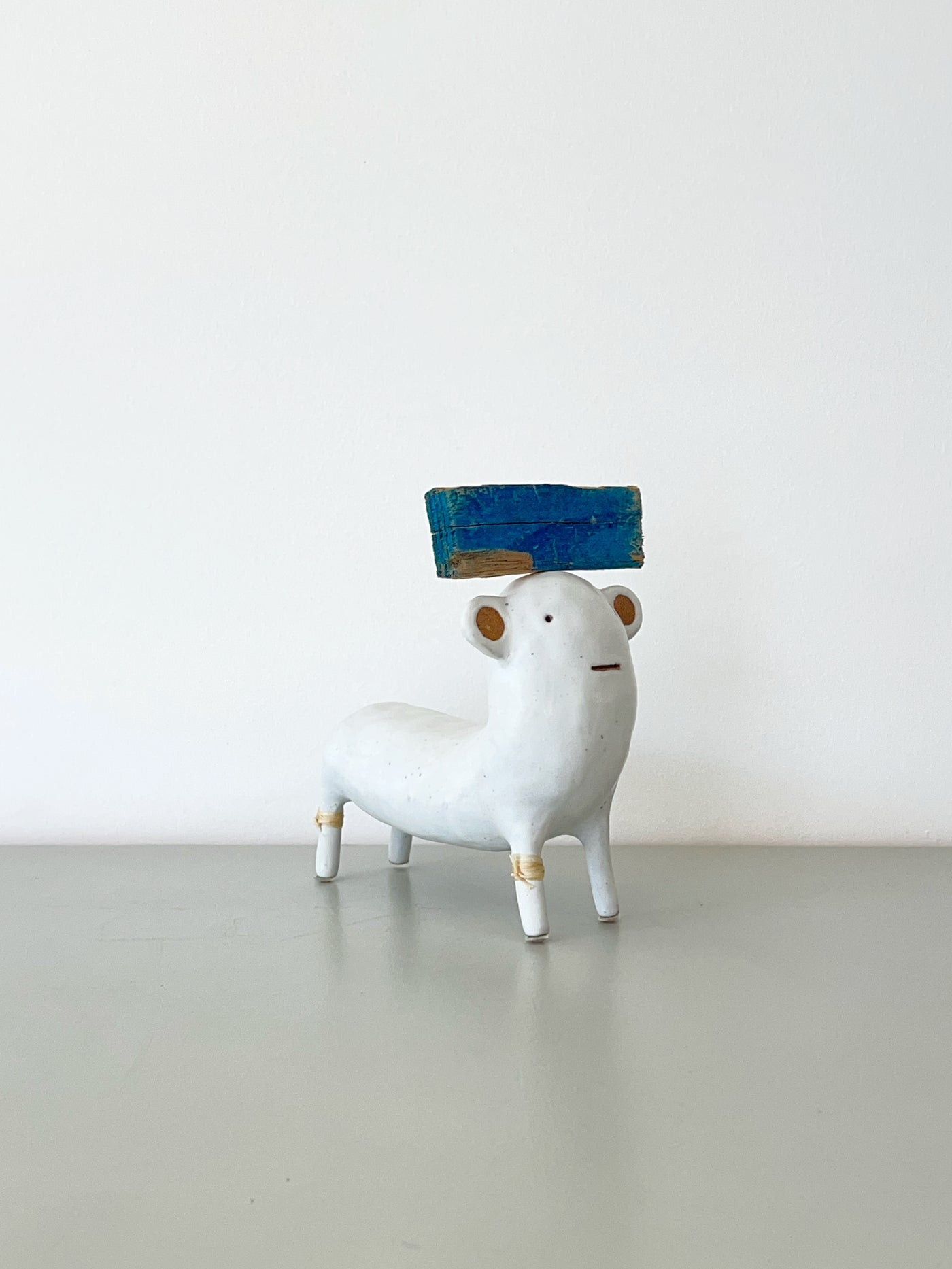 White with Blue Hat and Rawhide